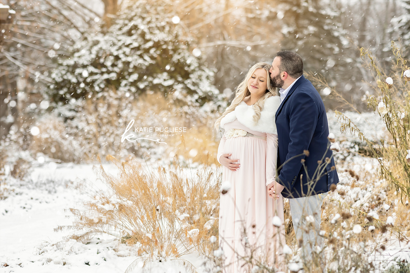 Winter maternity photography session in Connecticut with snow-covered landscape